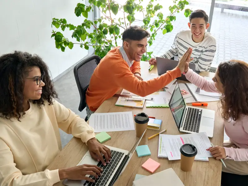 Students working in a lively happy group
